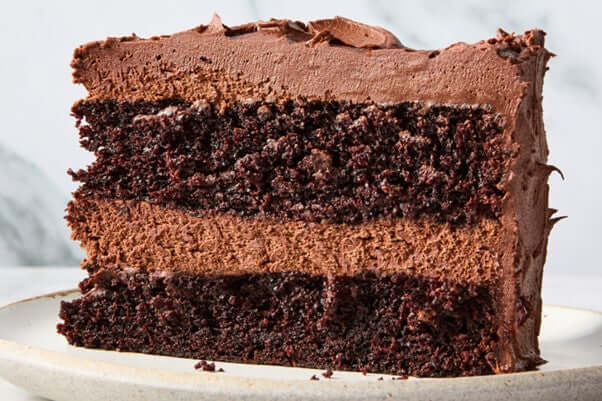 Premix Chocolate Cake & Cupcake Mix - Professional Quality slice of rich chocolate cake layered with creamy frosting.