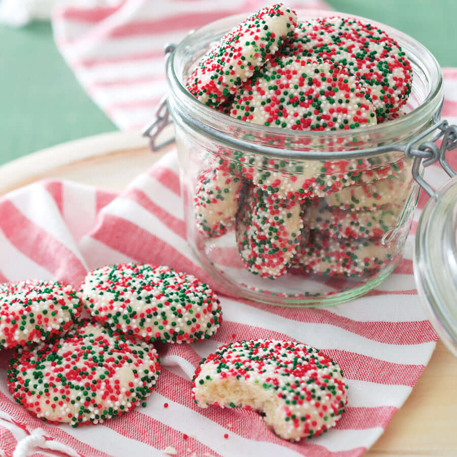 Cookies Christmas Sprinkle Cookies in a glass jar with festive red and green sprinkles, perfect for holiday celebrations.